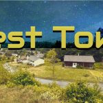 A photo of a small town with stars aboce and the words BEST TOWN