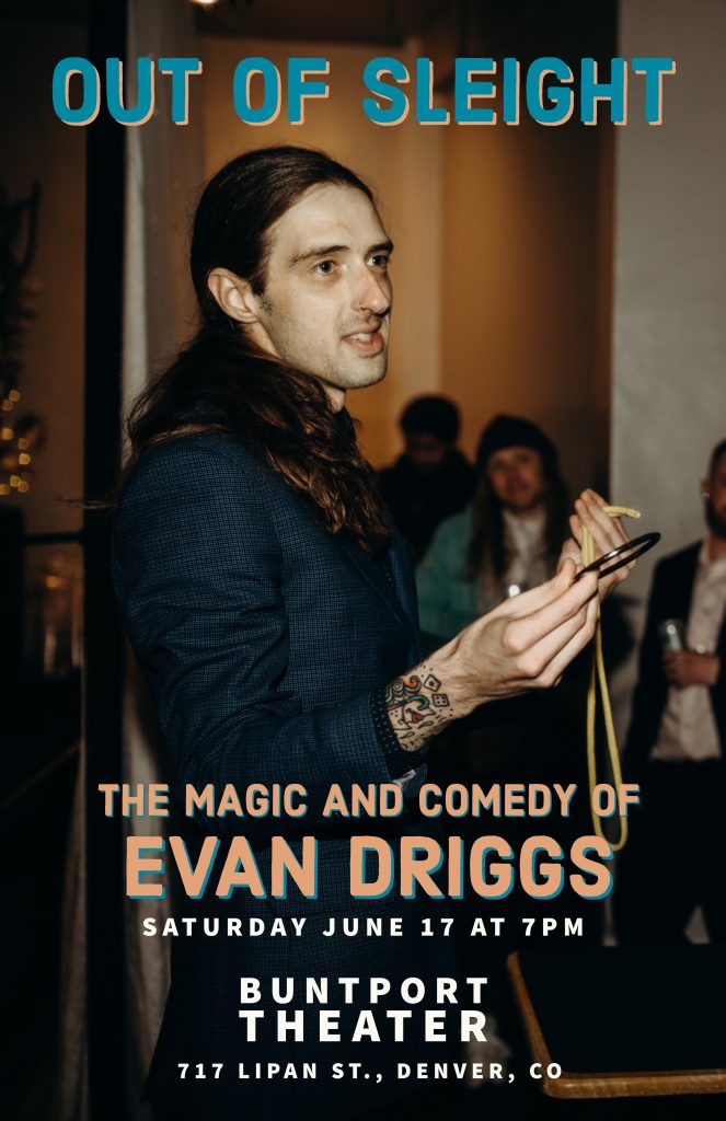 A man with long hair in a pony tail shows off a ring that is part of a magic trick.