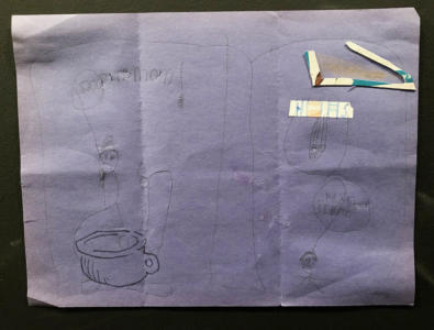 On a blue piece of construction paper is a child-like drawing of a person sitting on a cauldron-turned-toilet with a label “pooping mom”. To the right is another stick figure and a couple of cutout shapes pasted on.