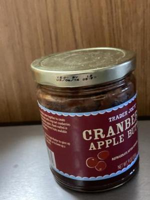 Close-up of a jar of cranberry apple butter.